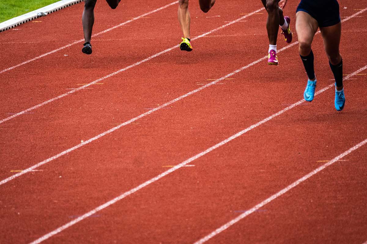 running track people running on race track sports